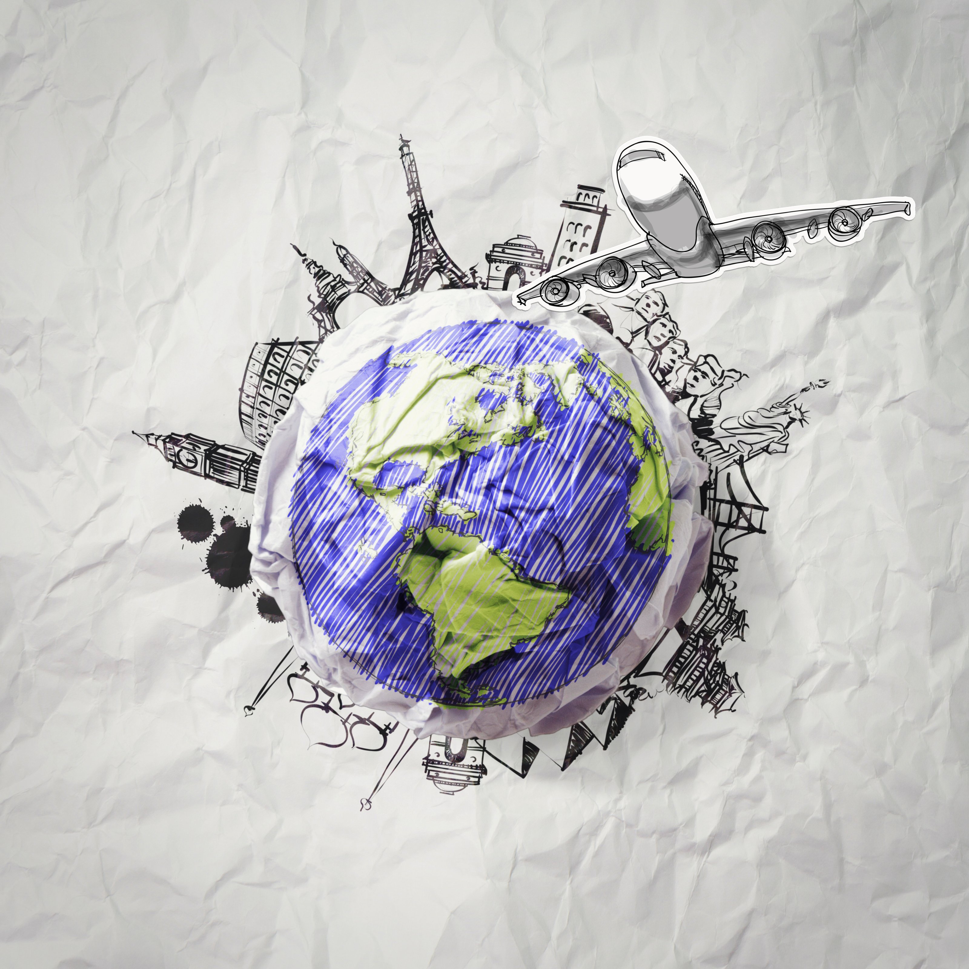 auf Papier gezeichnete Weltkugel mit internationalen Wahrzeichen kreisförmig darum