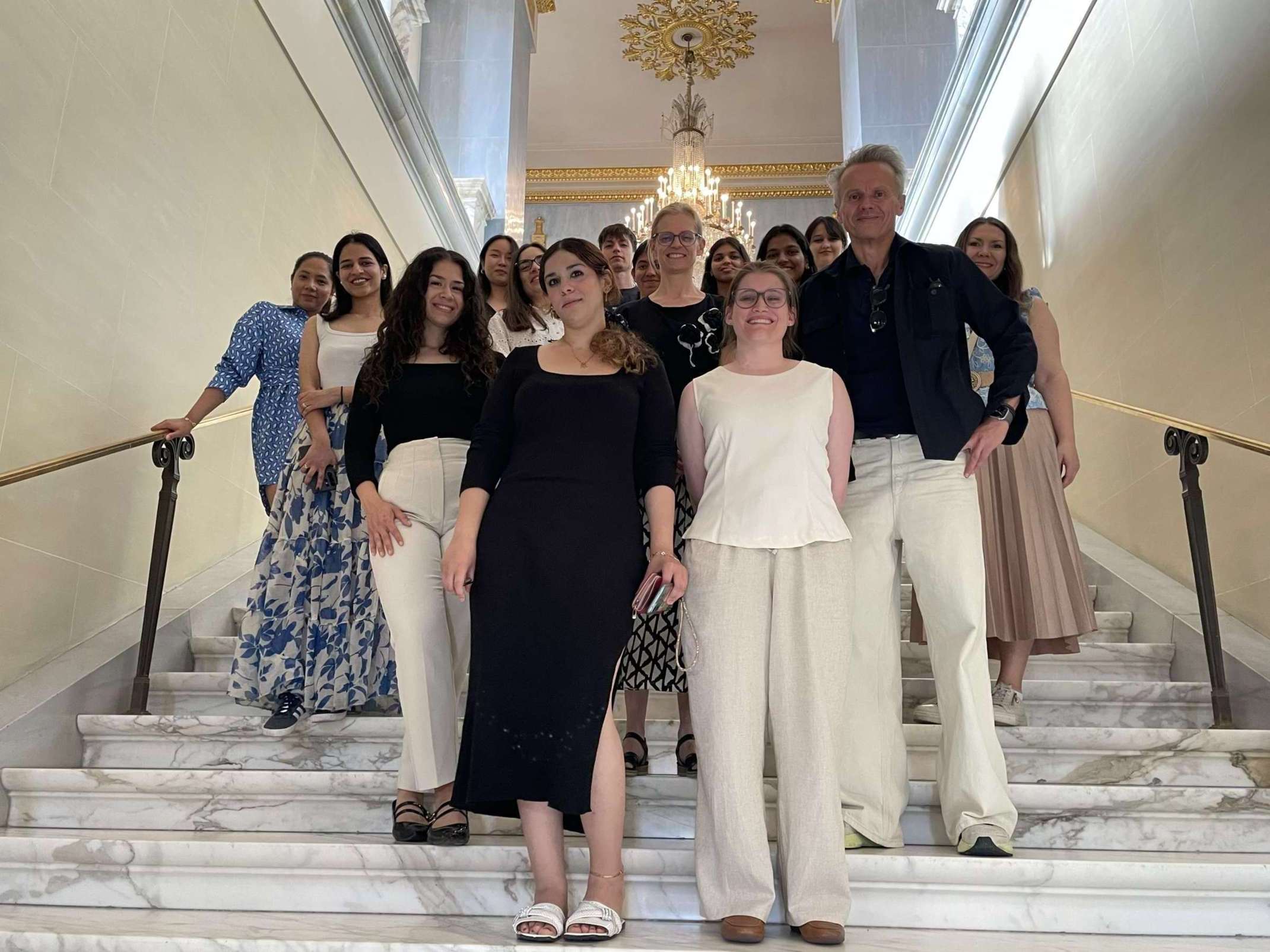 Student group with Prof. Dr. Thorsten Feix inside the Bavarian State Opera