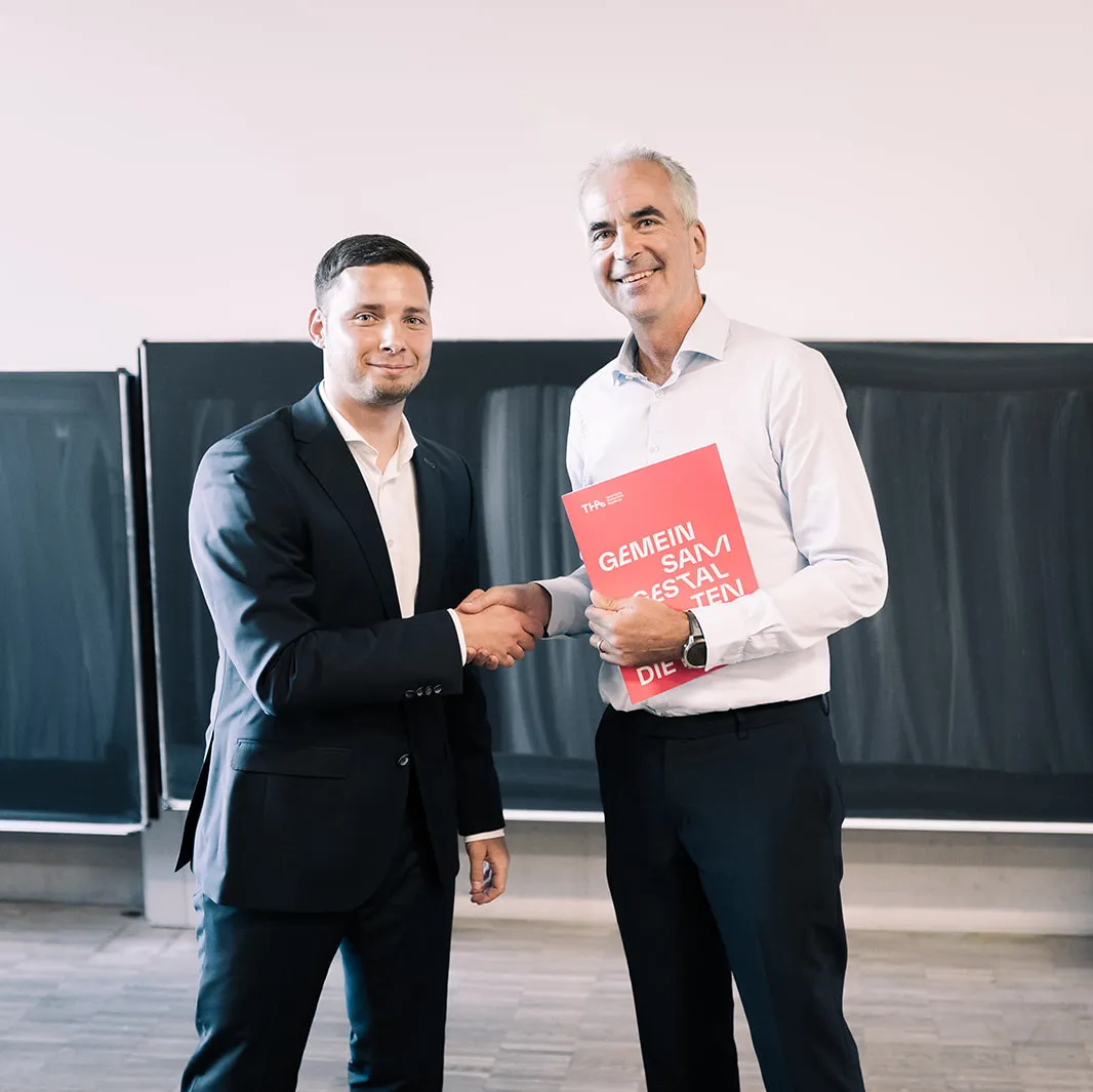 Graduate Fabian Ferber with Prof. Dr. Clemens Espe at the graduation ceremony