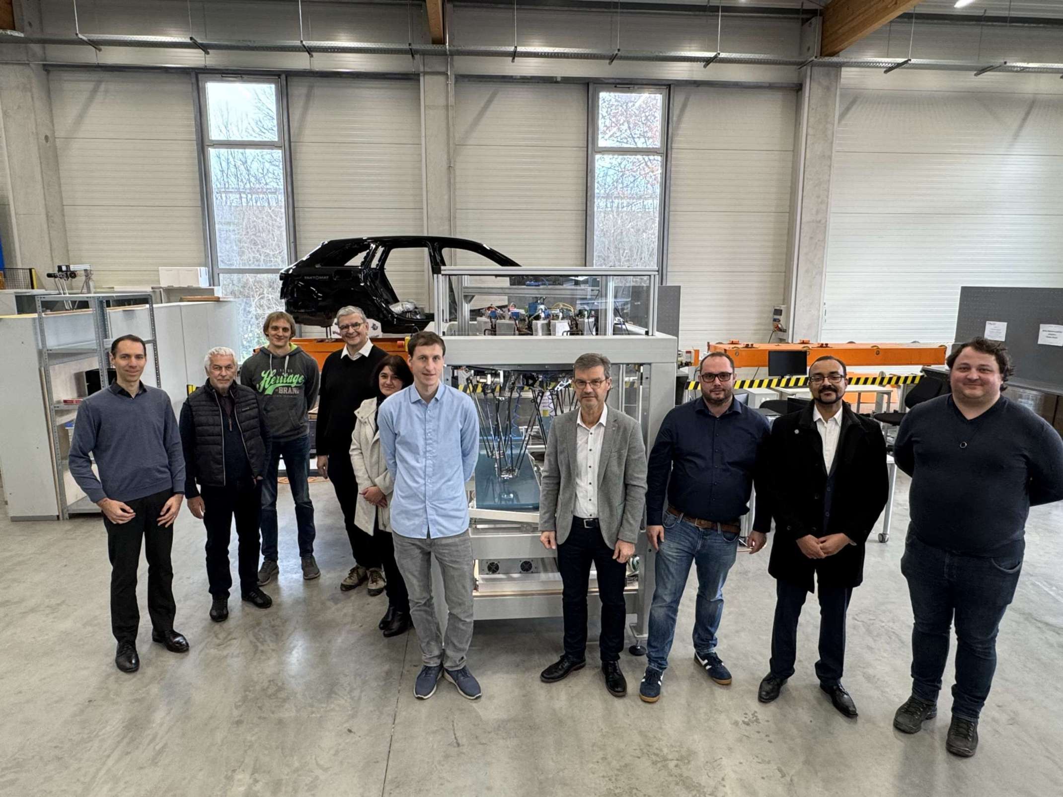 Gruppenfoto der Teilnehmer und Teilnehmerin